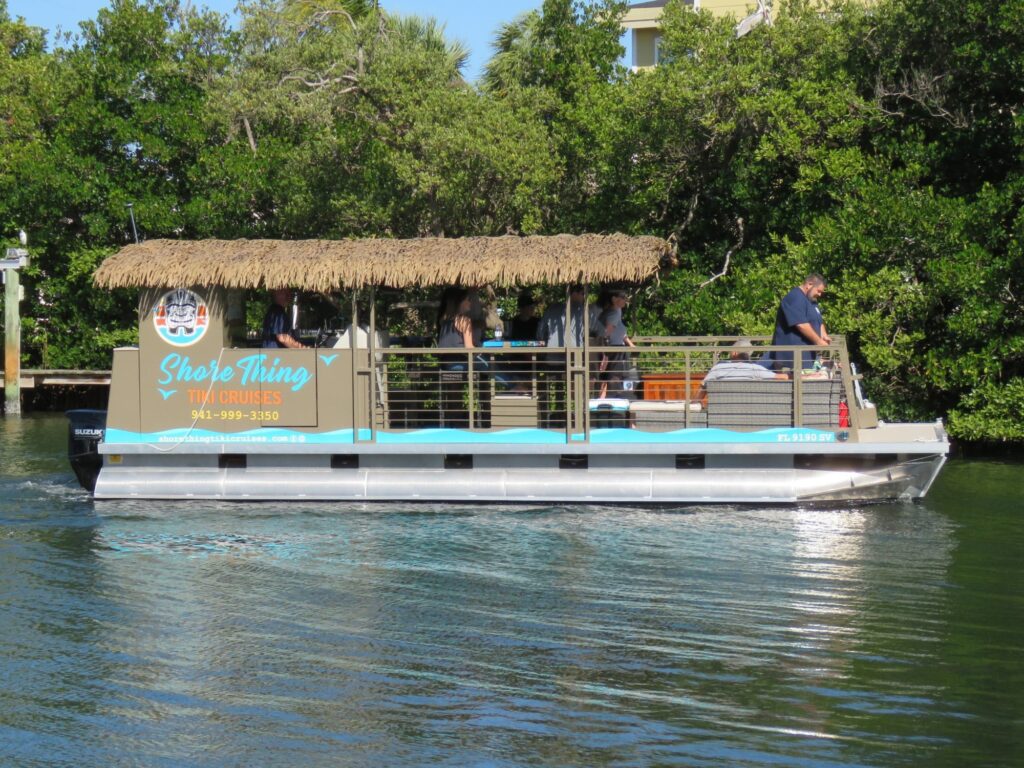 exterior of the shore thing tiki cruises boat in the water
